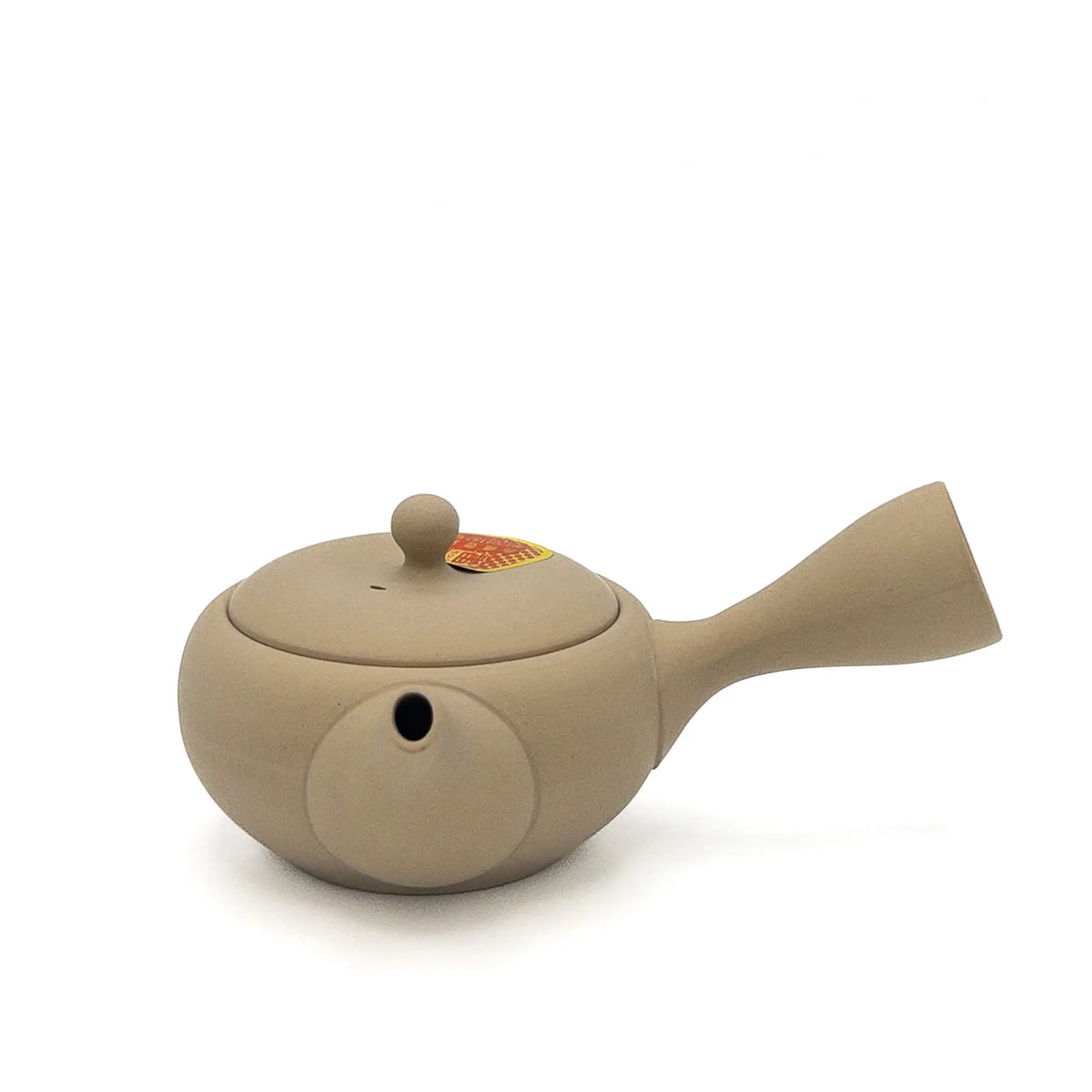 Beige Japanese teapot on a white background