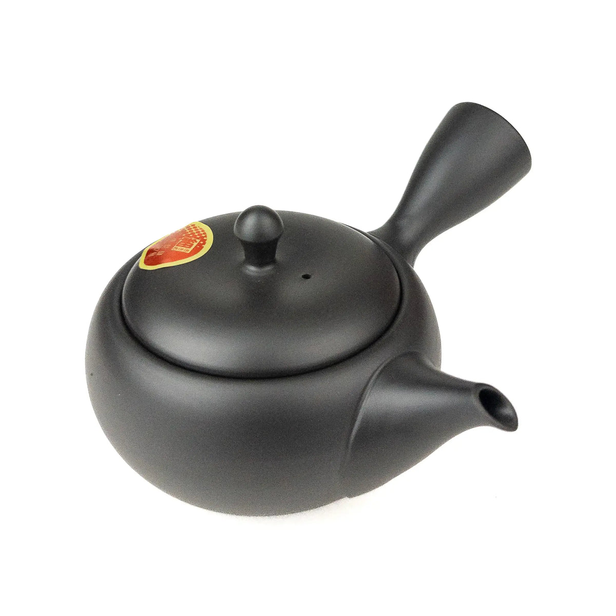 Black teapot with a lid on a white background