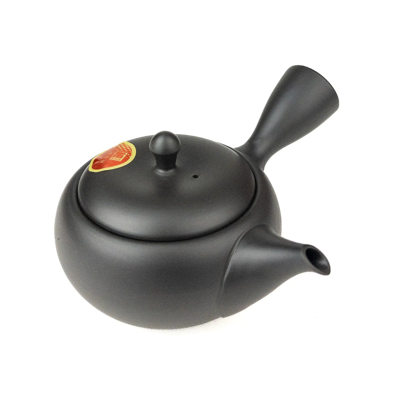 Black teapot with a lid on a white background