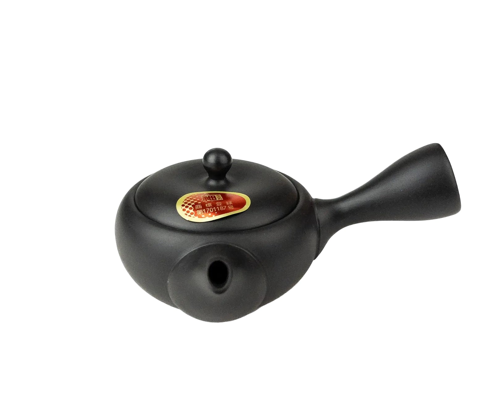 Black teapot with a gold emblem on a white background