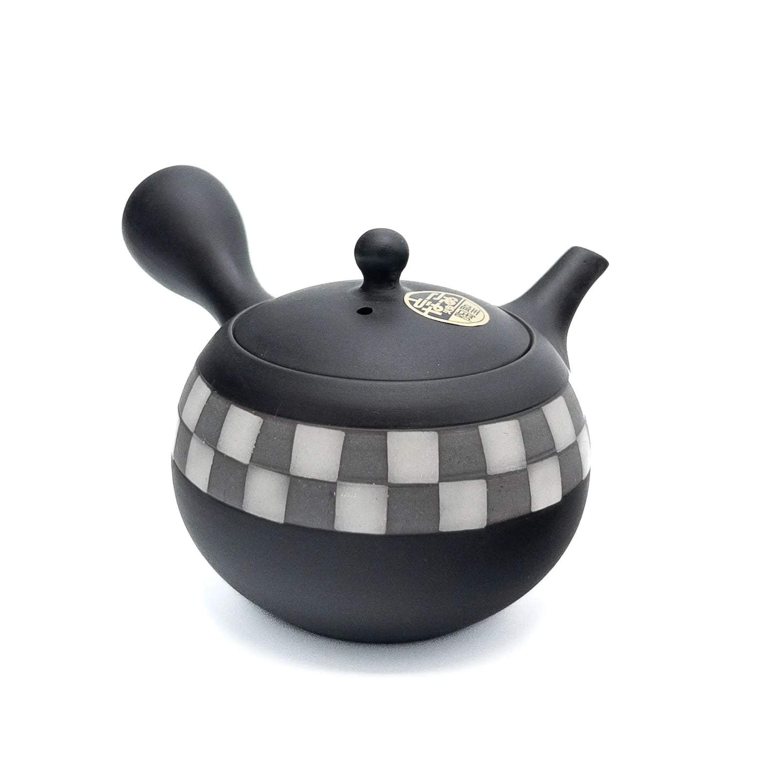 Black teapot with checkered pattern on a white background