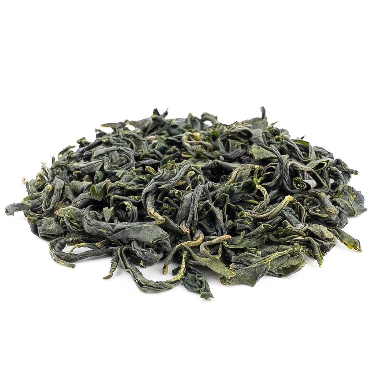 Dry leaves of Densho Kamairicha in a loose pile, long curled and twisted dark green pan-fired leaves