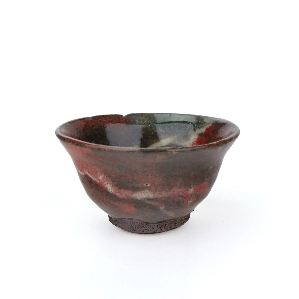 Mark Mohler gong fu cup #2C from a slightly raised angle showing red and green glaze inside the rim and red swirls on the outside