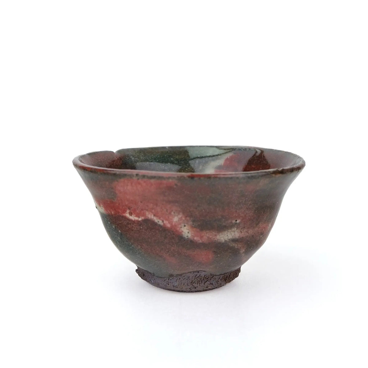 Mark Mohler gong fu cup #2C, side with swirls of deep red and grey green glaze above the unglazed foot