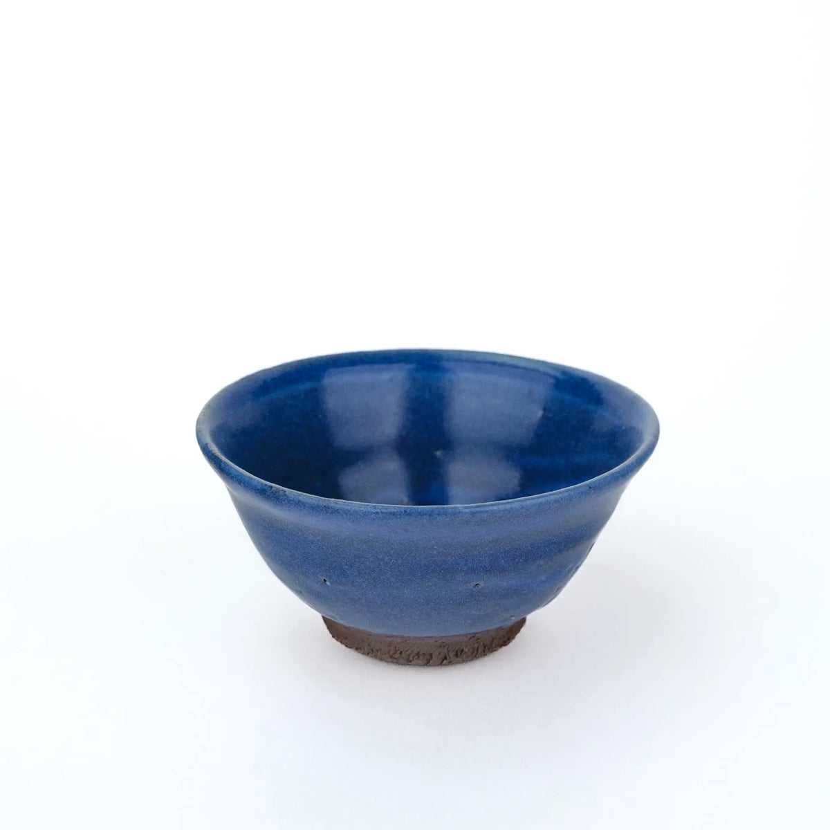 Mark Mohler gong fu cup #2Q from a raised angle showing the glossy deep blue glaze inside the cup