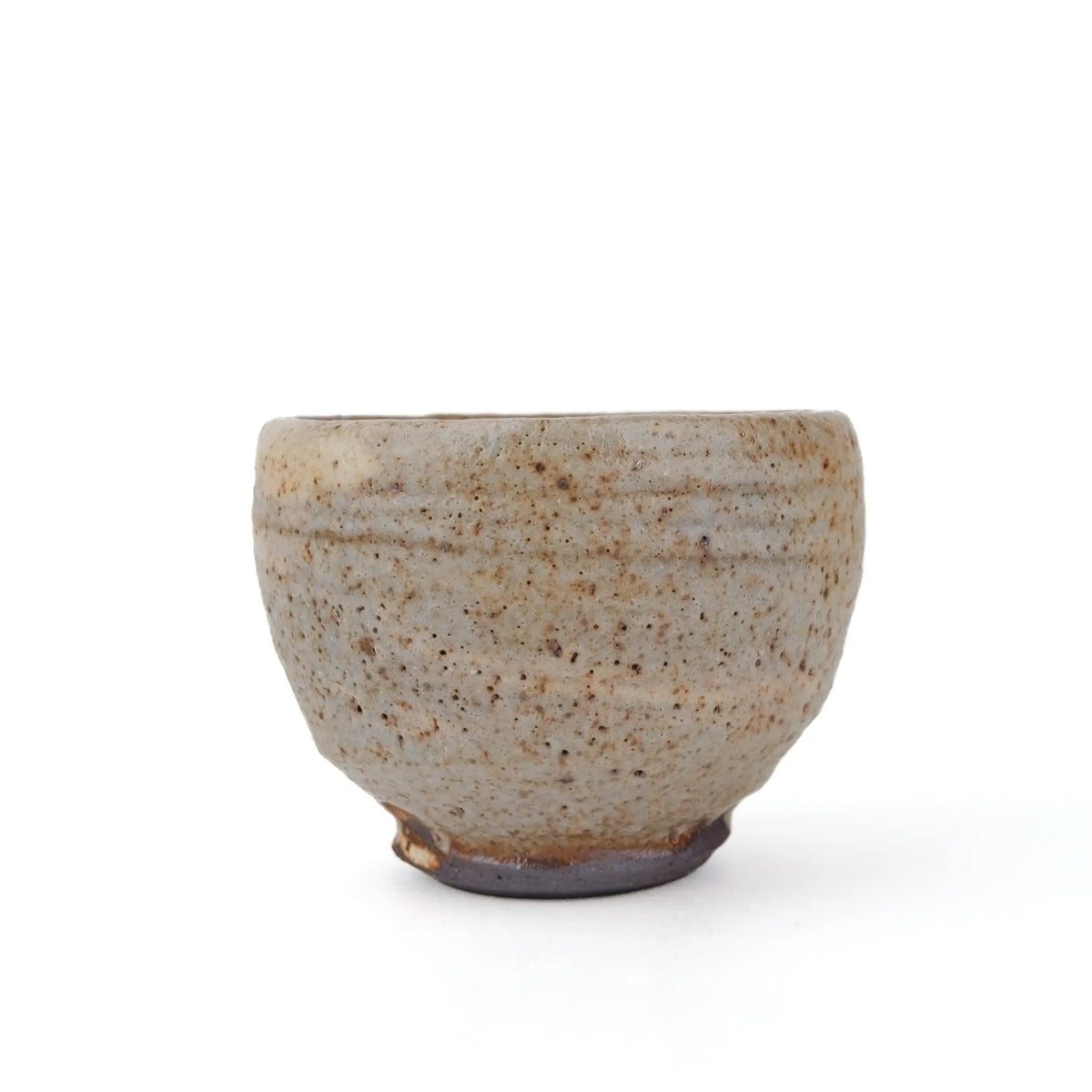 Mark Mohler handmade tea cup #N, opposite side showing the speckled pale glaze, rings from throwing and the dark foot