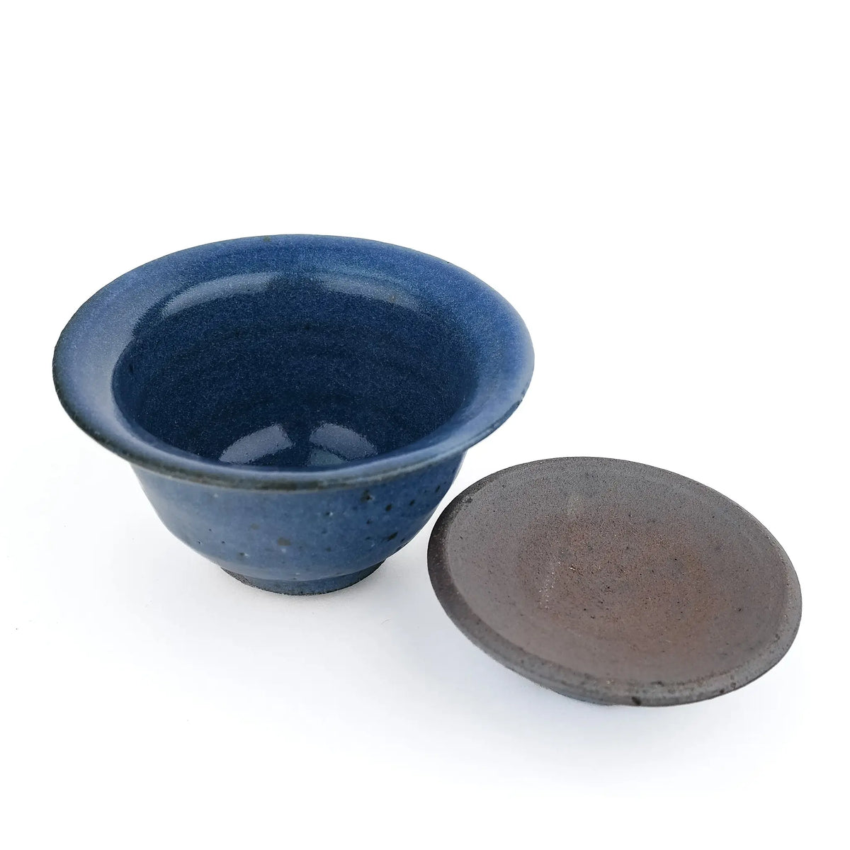 Mark Mohler handmade gaiwan #12 with the lid off and turned over beside the bowl, showing the blue glaze and throwing rings inside the bowl and the unglazed underside of the lid