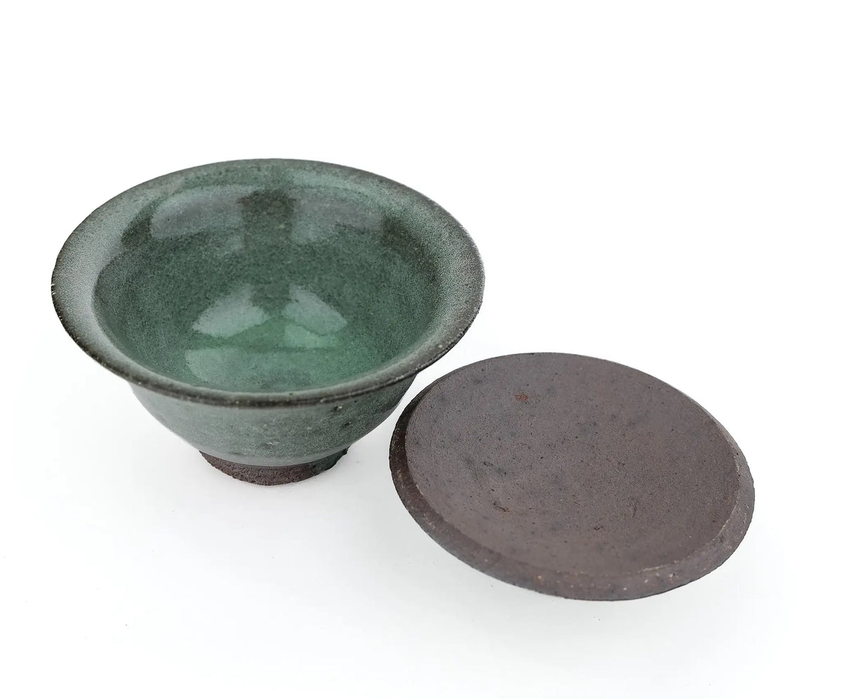 Mark Mohler handmade gaiwan #14 with the lid off and turned over beside the bowl, showing the glossy green glaze inside the bowl and the unglazed underside of the lid